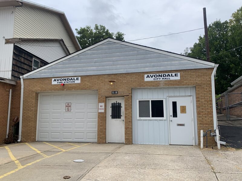 Avondale City Hall and fire station, a tan brick building with a white garage door